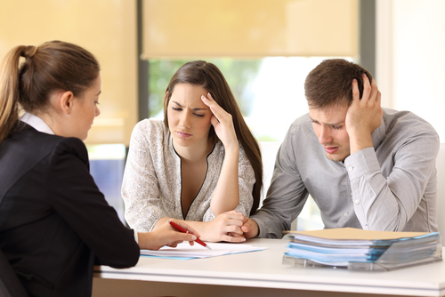 group of people reading a contract